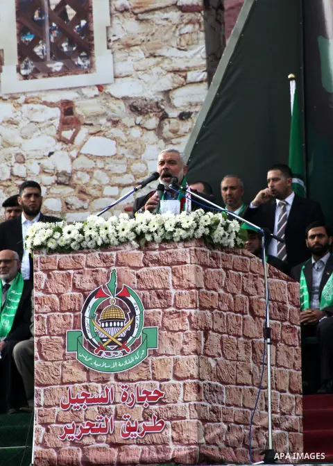 Palestinian prime minister in Gaza Strip, Ismail Haniyah speaks during a Hamas rally marking the 25th anniversary of the Islamist movement's founding in Gaza City on December 8, 2012. Meshaal arrived to Gaza strip on Dec...