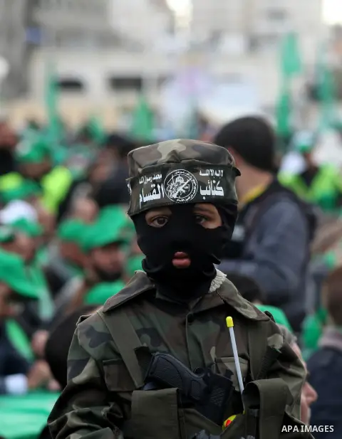 Palestinian Hamas supporters attend a Hamas rally marking the 25th anniversary of the Islamist movement's founding in Gaza City on December 8, 2012. Hamas chief Khaled Meshaal arrived to Gaza strip on December 7 during h...