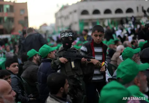Palestinian Hamas supporters attend a Hamas rally marking the 25th anniversary of the Islamist movement's founding in Gaza City on December 8, 2012. Hamas chief Khaled Meshaal arrived to Gaza strip on December 7 during h...