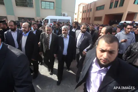 Hamas chief Khaled Meshaal, is greeted during his visit to the Islamic University in Gaza City December 9, 2012. Meshaal, in a defiant speech during his first ever visit to Gaza, told a mass rally on Saturday he would ne...