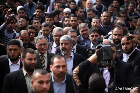 Hamas chief Khaled Meshaal, is greeted during his visit to the Islamic University in Gaza City December 9, 2012. Meshaal, in a defiant speech during his first ever visit to Gaza, told a mass rally on Saturday he would ne...