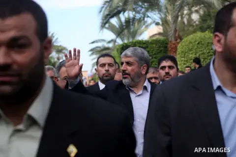 Hamas chief Khaled Meshaal, is greeted during his visit to the Islamic University in Gaza City December 9, 2012. Meshaal, in a defiant speech during his first ever visit to Gaza, told a mass rally on Saturday he would ne...