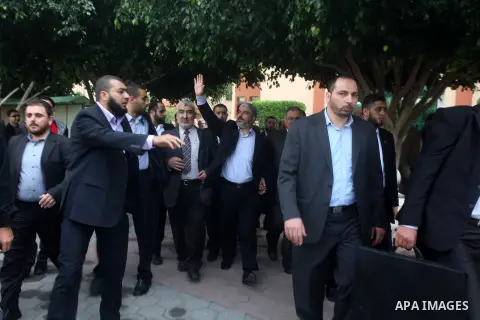 Hamas chief Khaled Meshaal, is greeted during his visit to the Islamic University in Gaza City December 9, 2012. Meshaal, in a defiant speech during his first ever visit to Gaza, told a mass rally on Saturday he would ne...