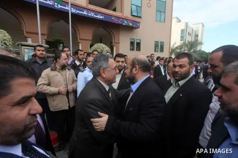 Hamas chief in exile Khaled Meshaal, waves at supporters during a visit to the Islamic University in Gaza City on December 9, 2012. Meshaal rejected ceding "an inch" of Palestinian territory to Israel or recognising the...
