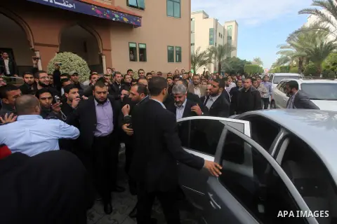 Hamas chief in exile Khaled Meshaal, waves at supporters during a visit to the Islamic University in Gaza City on December 9, 2012. Meshaal rejected ceding "an inch" of Palestinian territory to Israel or recognising the...