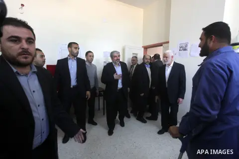 Hamas chief Khaled Meshaal, is greeted during his visit to a project funded by the Turkish President ragab ardogan in the Islamic University in Gaza City December 9, 2012. Meshaal, in a defiant speech during his first ev...