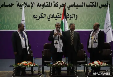 Hamas chief in exile Khaled Meshaal, waves at supporters during a visit to the Islamic University in Gaza City on December 9, 2012. Meshaal rejected ceding "an inch" of Palestinian territory to Israel or recognising the...