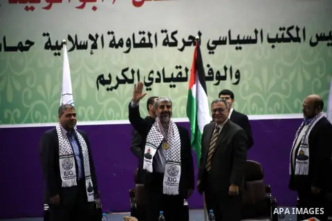 Hamas chief in exile Khaled Meshaal, waves at supporters during a visit to the Islamic University in Gaza City on December 9, 2012. Meshaal rejected ceding "an inch" of Palestinian territory to Israel or recognising the...