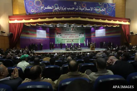 Hamas chief in exile Khaled Meshaal, waves at supporters during a visit to the Islamic University in Gaza City on December 9, 2012. Meshaal rejected ceding "an inch" of Palestinian territory to Israel or recognising the...