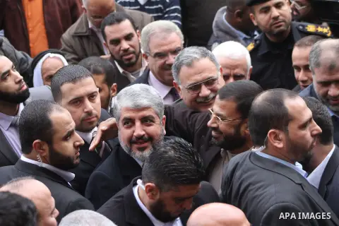 Hamas chief in exile Khaled Meshaal, waves at supporters during a visit to the Islamic University in Gaza City on December 9, 2012. Meshaal rejected ceding "an inch" of Palestinian territory to Israel or recognising the...