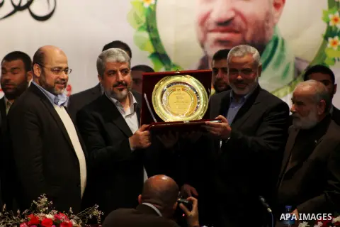 Hamas chief Khaled Meshaal attends a ceremony with Greek Orthodox Archbishop Alexios and senior Muslim cleric Hassan Al-Jojo in Gaza City December 9, 2012. Meshaal, in a defiant speech during his first ever visit to Gaza...