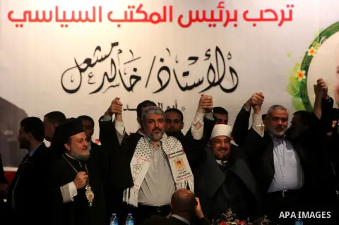 Hamas chief Khaled Meshaal attends a ceremony with Greek Orthodox Archbishop Alexios and senior Muslim cleric Hassan Al-Jojo in Gaza City December 9, 2012. Meshaal, in a defiant speech during his first ever visit to Gaza...