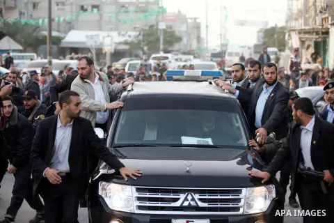 Hamas leader in exile Khaled Meshaal and Palestinian Prime Minister in the Gaza Strip Ismail Haniya ride their car to the Rafah crossing border, upon Meshaal departure from the Gaza Strip on December 10, 2012 in Gaza. Ex...