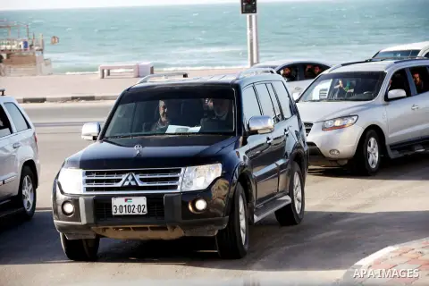 Hamas leader in exile Khaled Meshaal and Palestinian Prime Minister in the Gaza Strip Ismail Haniya ride their car to the Rafah crossing border, upon Meshaal departure from the Gaza Strip on December 10, 2012 in Gaza. Ex...