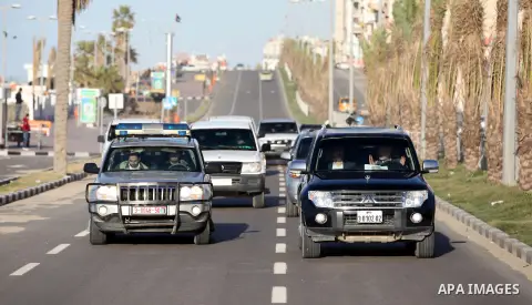 Hamas leader in exile Khaled Meshaal and Palestinian Prime Minister in the Gaza Strip Ismail Haniya ride their car to the Rafah crossing border, upon Meshaal departure from the Gaza Strip on December 10, 2012 in Gaza. Ex...