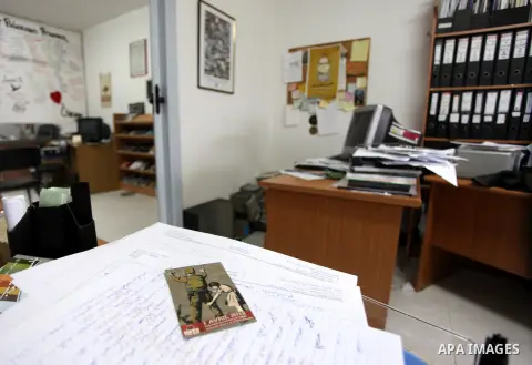 An employee checks a desk at the offices of the Addameer (Arabic for conscience) Prisoner Support and Human Rights offices, in the West Bank city of Ramallah, on December 11, 2012, after Israeli forces raided the offices...