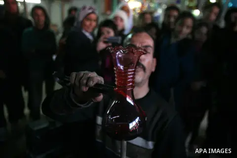 A Palestinian worker makes a different types of glasses in AL-SALAM factory in the West Bank city of Hebron December 12, 2012. Glass has been a traditional industry in Hebron for over 600 years but as a result of the inc...