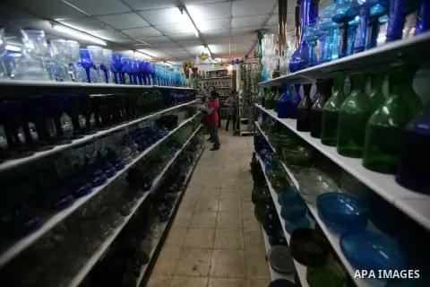 Palestinians buy a different types of glasses in AL-SALAM factory in the West Bank city of Hebron December 12, 2012. Glass has been a traditional industry in Hebron for over 600 years but as a result of the increased vio...