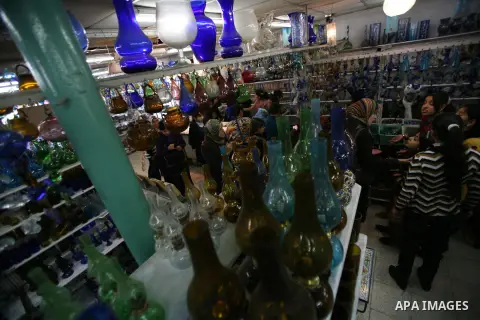 Palestinians buy a different types of glasses in AL-SALAM factory in the West Bank city of Hebron December 12, 2012. Glass has been a traditional industry in Hebron for over 600 years but as a result of the increased vio...