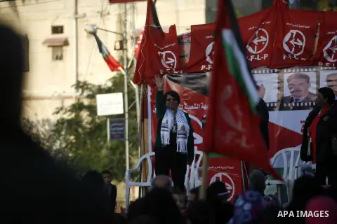 PFLP's Leila Khaled takes part in a rally organized by the Popular Front for the Liberation of Palestine (PFLP) to mark the 45th anniversary of the founding of the PFLP in Khan Younis southern Gaza strip, December 12, 20...