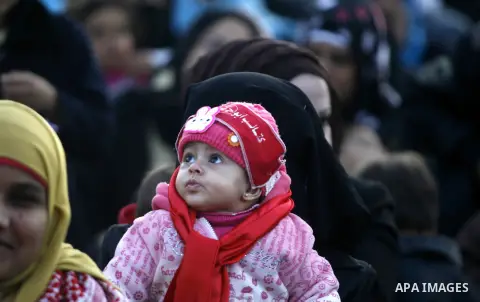 Supporters of the Popular Front for the Liberation of Palestine (PFLP) carry the party flag during a rally to mark the 45th anniversary of the founding of the PFLP in Khan Younis southern Gaza strip, December 12, 2012. P...
