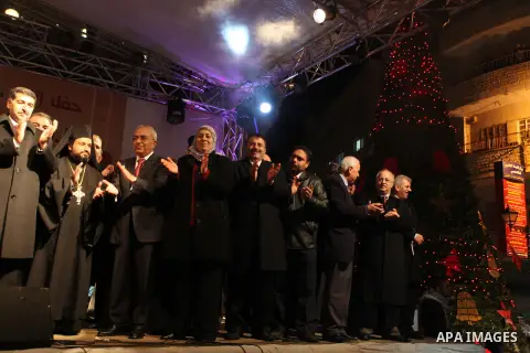 Palestinian prime minister Salam Fayyad attends a celebration by Palestinian Christians and Muslims to inaugurate Christmas' decorations in the West Bank city of Ramallah, on December 12, 2012. Photo by Issam Rimawi