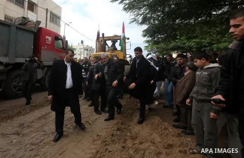 Palestinian Prime Minister Ismail Haniyeh and Qatari ambassador Mohammed al-Imadi visit bombed area during the launching ceremony of Qatari grant projects in Gaza city on 13 Dec, 2012. The emir of Qatar Sheikh Hamad bin...