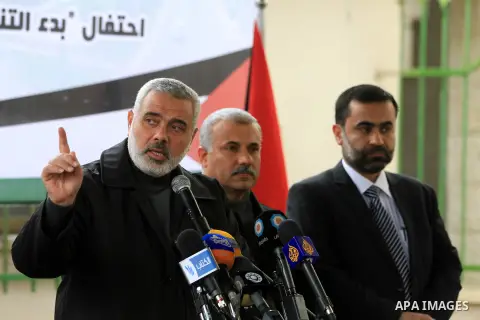Palestinian Prime Minister Ismail Haniyeh speaks during the launching ceremony of Qatari grant projects in Gaza city on 13 Dec, 2012. The emir of Qatar Sheikh Hamad bin Khalifa Al Thani announced an increase in Qatar's g...