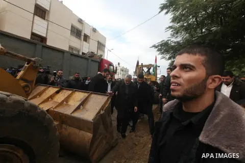 Palestinian Prime Minister Ismail Haniyeh and Qatari ambassador Mohammed al-Imadi visit bombed area during the launching ceremony of Qatari grant projects in Gaza city on 13 Dec, 2012. The emir of Qatar Sheikh Hamad bin...