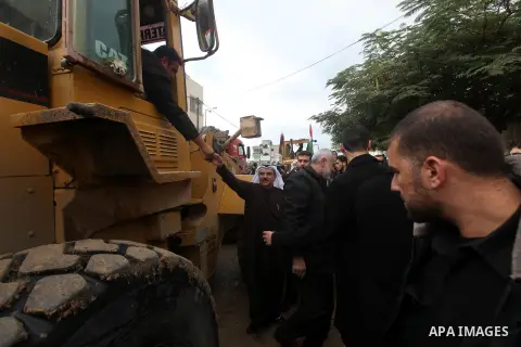 Palestinian Prime Minister Ismail Haniyeh and Qatari ambassador Mohammed al-Imadi visit bombed area during the launching ceremony of Qatari grant projects in Gaza city on 13 Dec, 2012. The emir of Qatar Sheikh Hamad bin...
