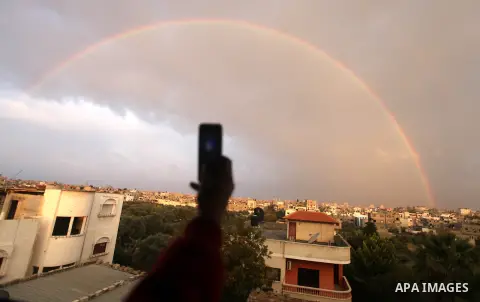 A rainbow is seen over the Gaza city after a rainy day on December 13, 2012. Photo by Majdi Fathi