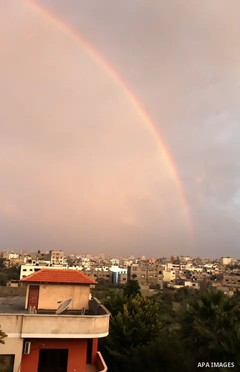 A rainbow is seen over the Gaza city after a rainy day on December 13, 2012. Photo by Majdi Fathi