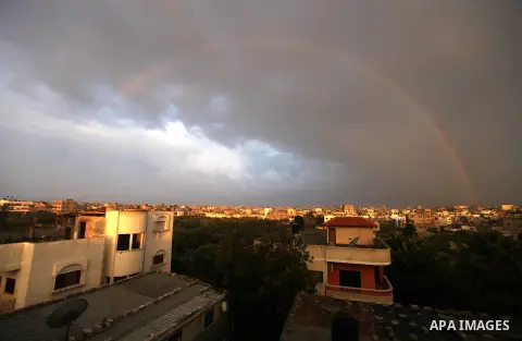 A rainbow is seen over the Gaza city after a rainy day on December 13, 2012. Photo by Majdi Fathi