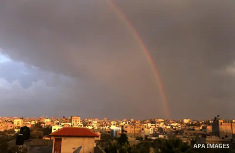 A rainbow is seen over the Gaza city after a rainy day on December 13, 2012. Photo by Majdi Fathi