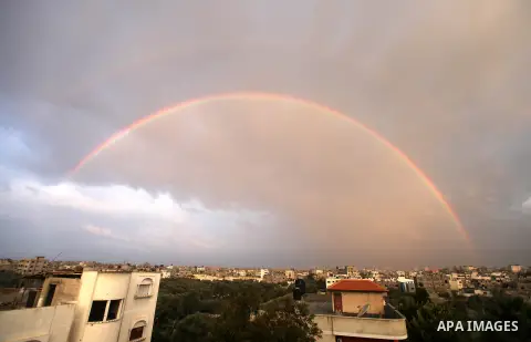 A rainbow is seen over the Gaza city after a rainy day on December 13, 2012. Photo by Majdi Fathi