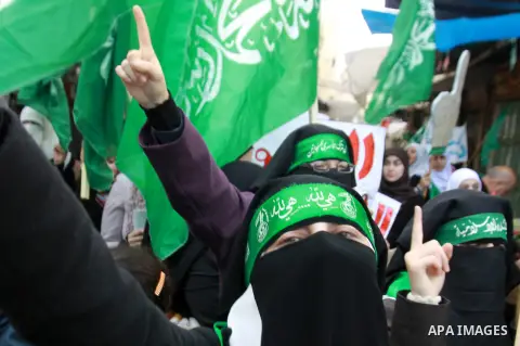 Palestinian Hamas supporters attend a Hamas rally marking the 25th anniversary of the Islamist movement's founding in the West Bank city of Nablus on December 13, 2012. Rapprochement between rival Palestinian factions Ha...