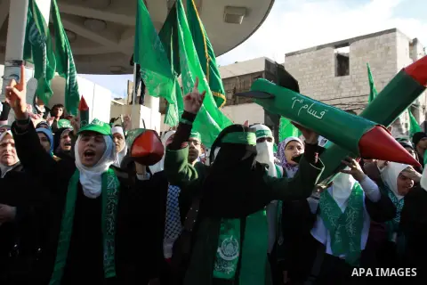 Palestinian Hamas supporters attend a Hamas rally marking the 25th anniversary of the Islamist movement's founding in the West Bank city of Nablus on December 13, 2012. Rapprochement between rival Palestinian factions Ha...
