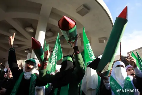 Palestinian Hamas supporters attend a Hamas rally marking the 25th anniversary of the Islamist movement's founding in the West Bank city of Nablus on December 13, 2012. Rapprochement between rival Palestinian factions Ha...