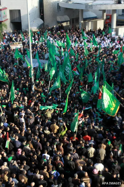 Palestinian Hamas supporters attend a Hamas rally marking the 25th anniversary of the Islamist movement's founding in the West Bank city of Nablus on December 13, 2012. Rapprochement between rival Palestinian factions Ha...