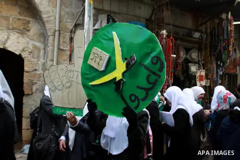 Palestinian Hamas supporters attend a Hamas rally marking the 25th anniversary of the Islamist movement's founding in the West Bank city of Nablus on December 13, 2012. Rapprochement between rival Palestinian factions Ha...