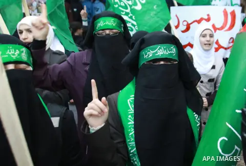 Palestinian Hamas supporters attend a Hamas rally marking the 25th anniversary of the Islamist movement's founding in the West Bank city of Nablus on December 13, 2012. Rapprochement between rival Palestinian factions Ha...