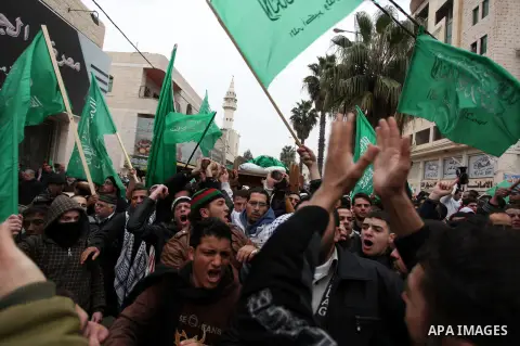 Palestinians carry the body of teenager Mohammed Ziad Salaymeh during his funeral in the West Bank city of Hebron, 13 December 2012. Israeli border police in the divided West Bank city of Hebron on 12 December shot dead...