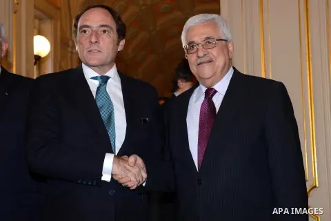 Palestinian President Mahmoud Abbas is welcomed by Portugal's Foreign Minister Paulo Portas (L) at the Necessidades Palace in Lisbon December 13, 2012. Photo by Thaer Ganaim