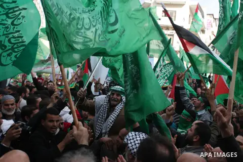 Palestinian supporters of Hamas attend a rally marking the 25th anniversary of the Islamist movement's foundation in the West bank city of Ramallah, 14 December 2012. Hamas held its first rally in the West Bank on 13 Dec...