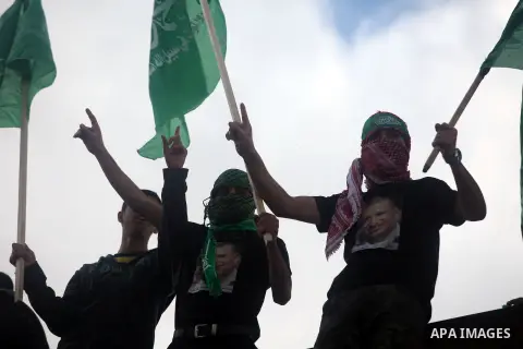 Palestinian supporters of Hamas attend a rally marking the 25th anniversary of the Islamist movement's foundation in the West bank city of Ramallah, 14 December 2012. Hamas held its first rally in the West Bank on 13 Dec...