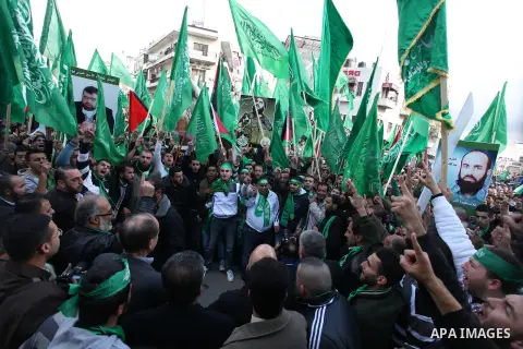 Palestinian supporters of Hamas attend a rally marking the 25th anniversary of the Islamist movement's foundation in the West bank city of Ramallah, 14 December 2012. Hamas held its first rally in the West Bank on 13 Dec...