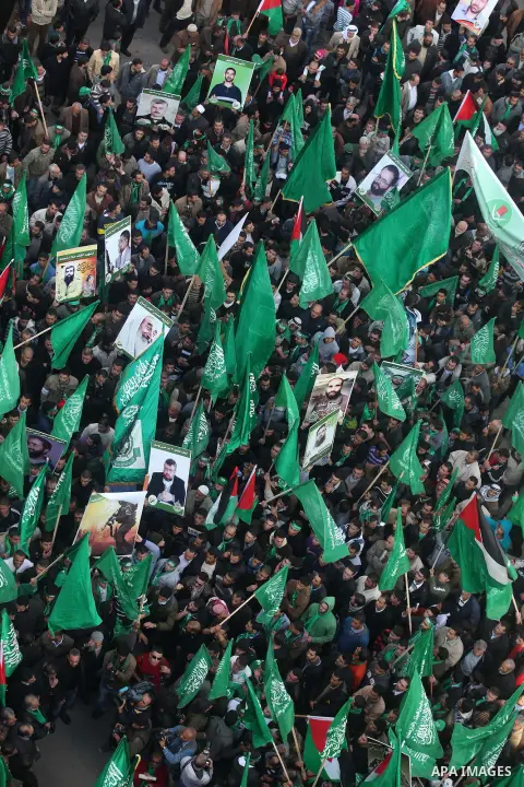 Palestinian supporters of Hamas attend a rally marking the 25th anniversary of the Islamist movement's foundation in the West bank city of Ramallah, 14 December 2012. Hamas held its first rally in the West Bank on 13 Dec...