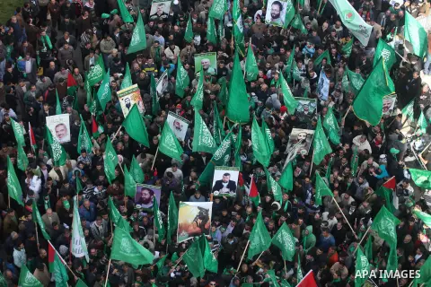 Palestinian supporters of Hamas attend a rally marking the 25th anniversary of the Islamist movement's foundation in the West bank city of Ramallah, 14 December 2012. Hamas held its first rally in the West Bank on 13 Dec...