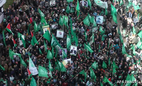 Palestinian supporters of Hamas attend a rally marking the 25th anniversary of the Islamist movement's foundation in the West bank city of Ramallah, 14 December 2012. Hamas held its first rally in the West Bank on 13 Dec...