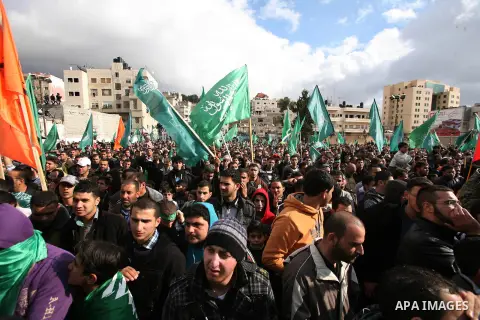 Hamas supporters take part in a rally celebrating the 25th anniversary of the founding of the Islamist mouvement, on December 14, 2012, in the West Bank city of Hebron. The rally is the first time that the West Bank's ru...